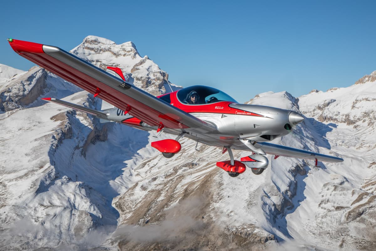 Bristell B23 Mosaic banking over snow-covered peaks