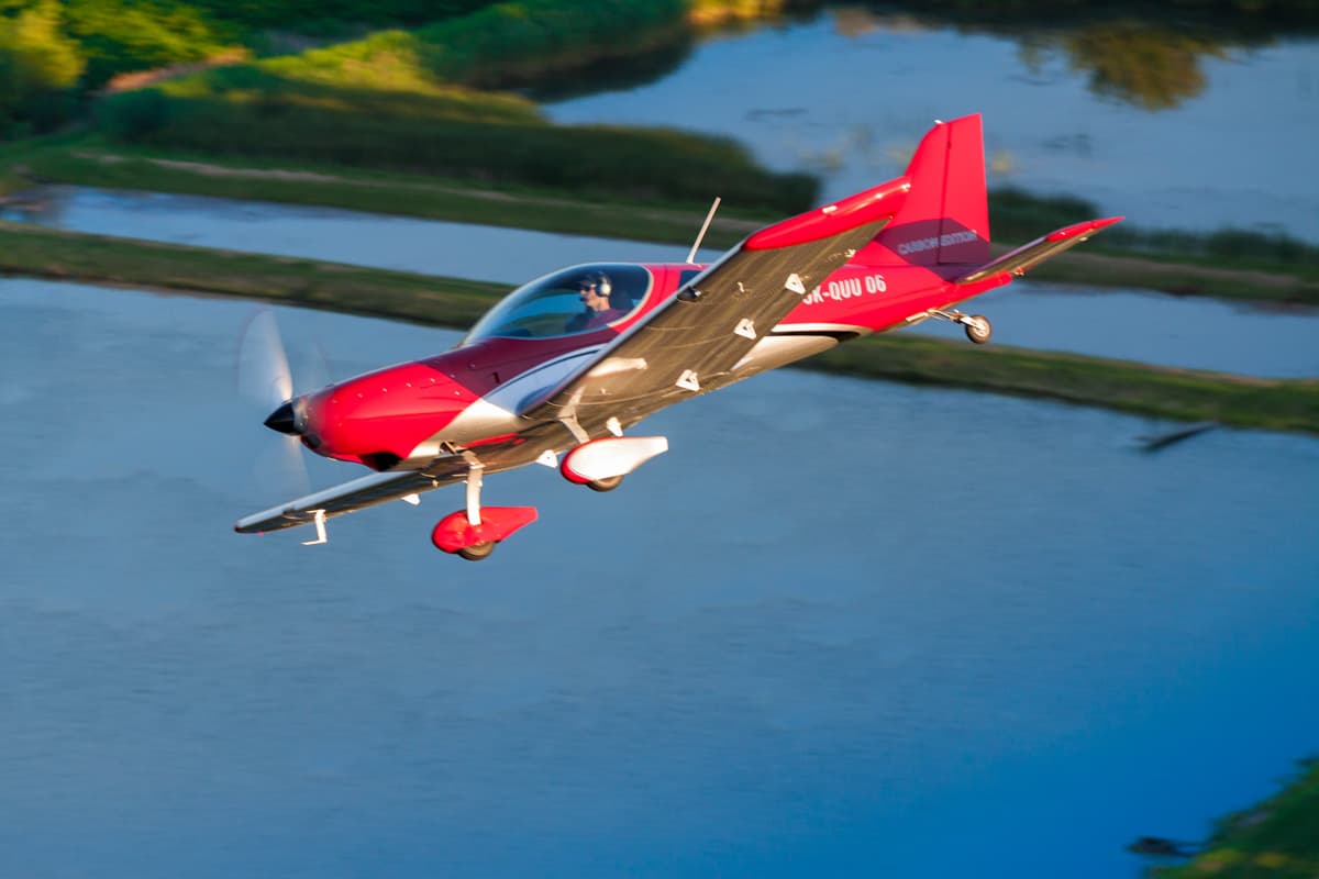 Carbon-edition Bristell TDO banking over the water